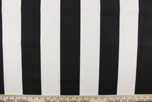 Load image into Gallery viewer, This indoor/outdoor fabric in black and white stripes is perfect for any project where the fabric will be exposed to the weather.  It is fade resistant and UV tested and can withstand 1000 hours of direct sunlight.  It is stain and water repellant and has a resistance to bleach, dirt and mildew.  Uses include cushions, tablecloths, upholstery projects, decorative pillows and craft projects. This fabric has a slightly stiff feel but is easy to work with. 
