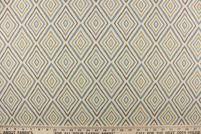 This fabric features a geometric design of diamonds in beige, sage green, brown and hints of light gray.