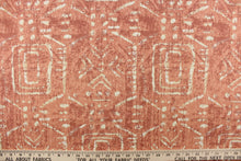 Load image into Gallery viewer, This fabric feature a geometric design resembling an Aztec design in off white with hints of light khaki against a faded red tone.
