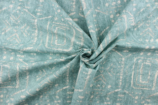 This fabric feature a geometric design resembling an Aztec design in white against a light blue.