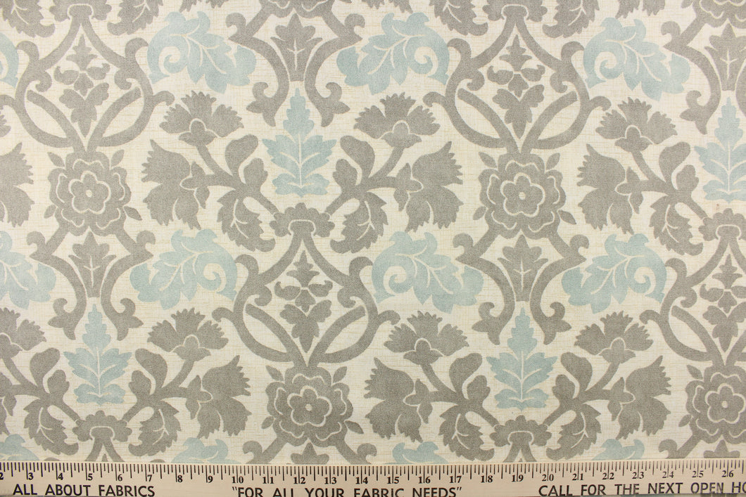 This fabric features a floral vine design in gray and pale blue against a off white background.