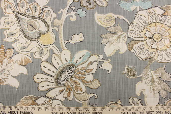 This fabric features a paisley floral design in brown, yellow, gray, pale turquoise blue and off white against a gray background.