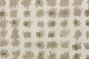  This fabric features a geometric design of small squares in brown gray tones against a off white background. 