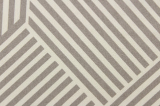 This fabric features a geometric design of stripes in gray and white. 