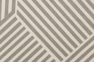 This fabric features a geometric design of stripes in gray and white. 