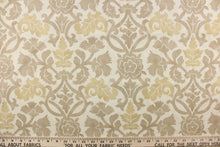 Load image into Gallery viewer, This fabric features a floral vine design in beige and khaki tones against a off white background. 
