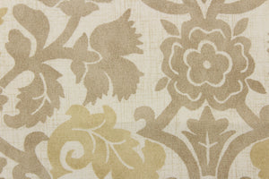 This fabric features a floral vine design in beige and khaki tones against a off white background. 