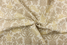 Load image into Gallery viewer, This fabric features a floral vine design in beige and khaki tones against a off white background. 
