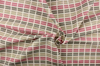 This fabric features a plaid design in beige, rose, taupe and cream