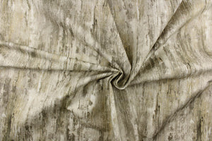 This fabric features a distress design in gray tones with hints of white and shades of brown. 