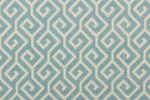 Load image into Gallery viewer, This fabric features a geometric design in light blue and off white. 
