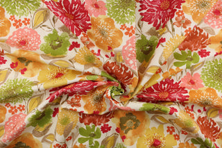 This bold color fabric features a floral design in red, pink, yellow, green, varying shades of orange and hints of taupe or beige on a off white background.