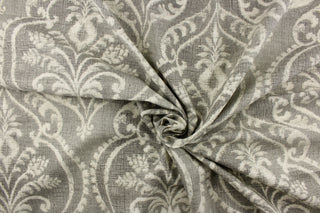 A beautiful damask design in white on a gray color with a vintage distressed look.