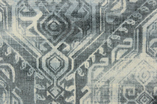 This fabric features a unique geometric design in shades of blue gray and off white.
