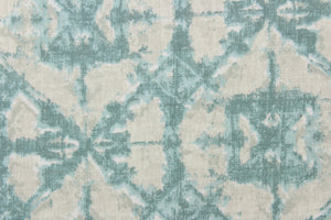  This geometric design in light gray, pale blue, and hints of teal and white offer a modern look.
