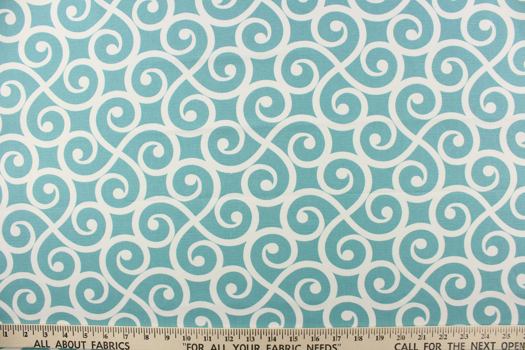 This fabric feature a delightful design of swirled lines that touch sides in white on a light teal background.