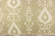 Load image into Gallery viewer,  This fabric features an ikat design in a khaki and off white.
