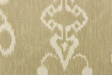 Load image into Gallery viewer,  This fabric features an ikat design in a khaki and off white.
