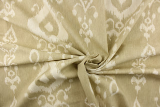  This fabric features an ikat design in a khaki and off white.