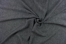 Load image into Gallery viewer,  This wool blend fabric is great for transitioning into cooler weather. It has a great hand and is hard-wearing. The durability and wrinkle resistance make it perfect for suits, tailored garments, drapery and light duty upholstery fabrics. Colors included are charcoal gray, black and white.
