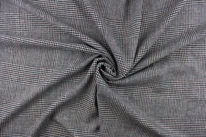 This duotone pattern wool blend fabric is great for transitioning into cooler weather.  It has a great hand and is hard-wearing.   The durability and wrinkle resistance make it perfect for suits, tailored garments, drapery and light duty upholstery fabrics. Colors included are black and white and red.