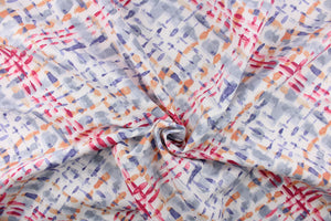 This outdoor fabric features a diagonal plaid design in pinks, orange, gray, and purple blue against a white background.
