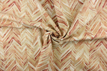 Load image into Gallery viewer,  This fabric features a chevron design in shades of red, orange, pale khaki and white .
