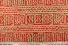 Load image into Gallery viewer, This fabric features a Aztec design in red and light khaki with hints of orange. 
