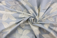 Load image into Gallery viewer,  This fabric features a contemporary floral design in blue and off white. 
