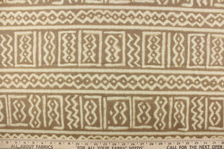 This fabric features a Aztec design in off white against a taupe background. 