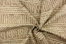 Load image into Gallery viewer, This fabric features a Aztec design in off white against a taupe background. 
