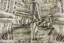 Load image into Gallery viewer, This fabric features an abstract design in gray, black, gold tone and white.

