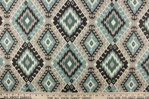  This fabric features a geometric design of diamonds in varying shades of teal, and gray with hints of black and white