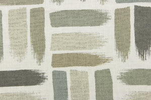This fabric features a geometric design of horizontal and vertical short brush strokes in shades of green gray tones, taupe against a dull white background.