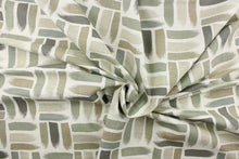 Load image into Gallery viewer, This fabric features a geometric design of horizontal and vertical short brush strokes in shades of green gray tones, taupe against a dull white background.
