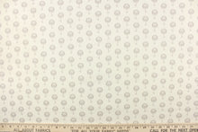 Load image into Gallery viewer, This fabric features a floral design in gray against a natural or off white background.
