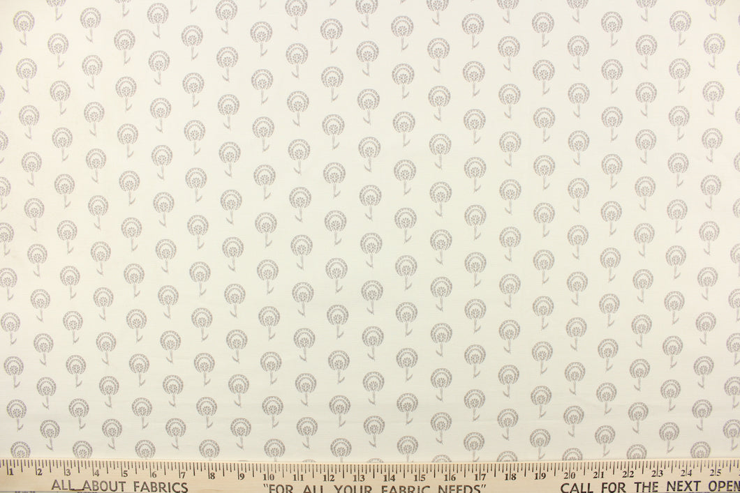 This fabric features a floral design in gray against a natural or off white background.