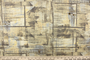 This fabric features an abstract design in shades of yellow and gray .