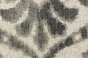  This fabric features a damask design in gray tones with hints of taupe against a natural background. 