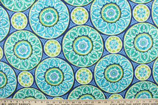 This fabric features a intricate circular design and is perfect for any project where the fabric will be exposed to the weather.  Colors included are green, white and shades of blue.