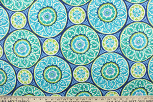 This fabric features a intricate circular design and is perfect for any project where the fabric will be exposed to the weather.  Colors included are green, white and shades of blue.