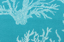 Load image into Gallery viewer, This fabric features white seacoral on a turquoise background and is perfect for any project where the fabric will be exposed to the weather. 
