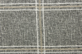 This multi functional fabric features white and khaki stripes on a gray background. 