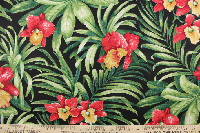This polyester printed fabric has tropical red and yellow flowers with large green leaves on a black background and is perfect for any project where the fabric will be exposed to the weather. 