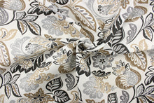 Load image into Gallery viewer, This decorative print features a floral and leaf metallic design set against a solid background and is perfect for any project where the fabric will be exposed to the weather. Colors include white, grey, black and stone.
