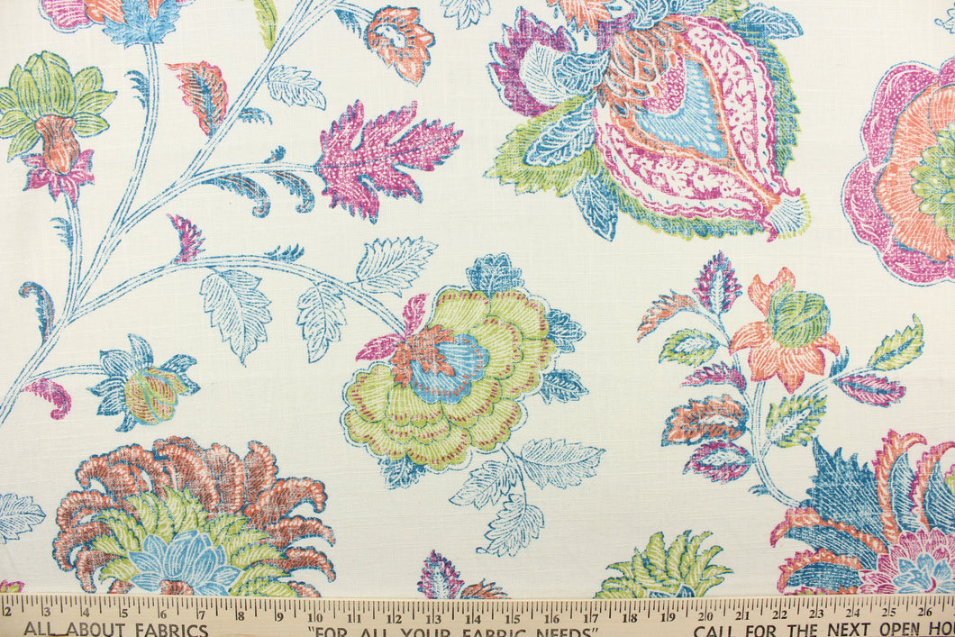This fabric features a large print floral design on a cream background.  Colors include blue, green, magenta pink and orange.