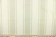 Load image into Gallery viewer, This fabric features stripes in natural on a light beige background. 
