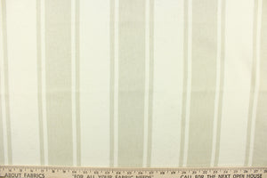 This fabric features stripes in natural on a light beige background. 