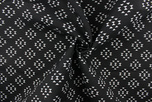 Load image into Gallery viewer, This screen printed outdoor fabric features a geometric design in white on a black background.  
