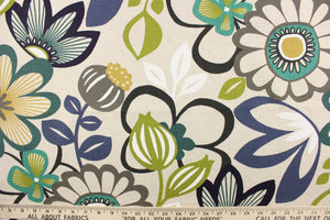  This cotton blend fabric features a large floral design in the colors of white, black, brown, blue and green set against a beige background. 